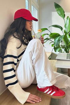 emilysupit on Instagram, red cap and red adidas gazelle comfy casual outfit, pink nails, stripey jumper, stripey pyjama, stockholm aesthetic scandinavian plant matcha