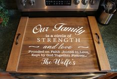 a wooden cutting board with the words our family is a circle of strength and love