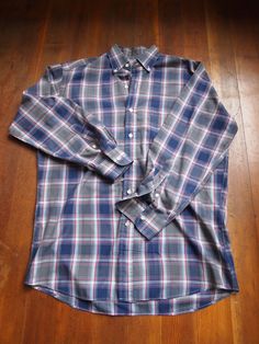 "Vintage Maxwell's Clothiers single pocket button down plaid shirt. Long Sleeve. made in Hong Kong. Embroidered emblem on cuff. Double button cuff. Cotton. In very good condition. Small discolored spot on sleeve.  Size: 14 1/2 Pit to Pit: 23\" Pit to Waist: 18\"" Classic Plaid Flannel Shirt With Button Cuffs, Classic Plaid Shirt With Button Cuffs, Button Down, Shirt Long Sleeve, Plaid Shirt, Hong Kong, Button Downs, Tee Shirts, Mens Shirts