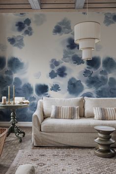 a living room with blue and white wallpaper