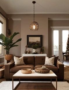 a living room filled with furniture and a christmas tree