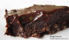 a piece of chocolate cake sitting on top of a table