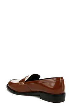 Minimalist design showcases the timeless silhouette of this sleek patent penny loafer with ergonomic padding at key pressure points for all-day comfort. 1" heel Synthetic upper, lining and sole Imported Modern Brown Loafers For Business Casual, Modern Brown Loafers For Office, Brown Patent Leather Slip-on Loafers, Classic Patent Leather Loafers For Office, Modern Brown Loafers With Almond Toe, Classic Brown Flat Loafers, Modern Brown Almond Toe Loafers, Brown Patent Leather Loafers With Round Toe, Classic Patent Leather Loafers For Business Casual