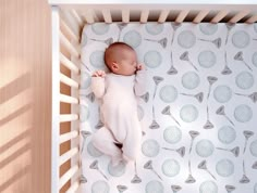 a baby is sleeping in a crib