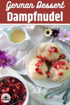 german dessert dampfued with strawberries and cream on a plate next to a bowl of fruit