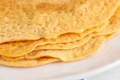 stack of corn tortillas on a white plate