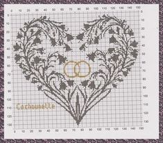 a cross stitch heart with two initials on it and the word love is written in gold