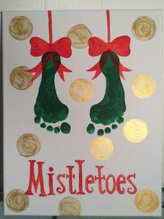 handprinted christmas card with gold coins and red ribbon hanging from the feet of two green shoes