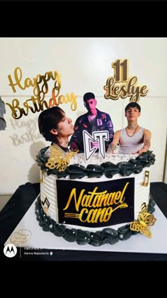 a birthday cake with the number 11 on it and two men in front of it