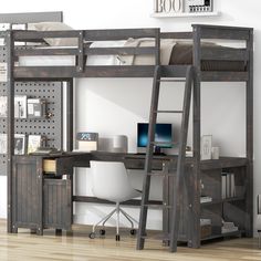 a loft bed with desk underneath it in a room that has hardwood floors and white walls