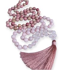 This mala necklace is made with 108 hand-knotted gemstone beads, each measuring 8mm. The gemstones used are Rhodochrosite, Rose Quartz, and White Quartz sure to raise your vibration to give and receive a higher love. Why 108 beads in a traditional mala necklace? Vedic culture viewed 108 as a number of the wholeness of existence. This number also connects the Sun, Moon, and Earth: The average distance of the Sun and the Moon to Earth is 108 times their respective diameters. Also, there are 54 let Spiritual Pink Crystal Necklaces For Healing, Pink Spiritual Crystal Necklace For Meditation, Rose Quartz Necklace With Gemstone Beads For Meditation, Rose Quartz 108 Beads Jewelry For Meditation, Spiritual Pink Beaded Necklaces With Natural Stones, Pink 8mm Beads Jewelry For Meditation, Spiritual Rose Quartz Crystal Necklace For Meditation, Pink Meditation Necklaces With Round Beads, Spiritual Healing Rose Quartz Beaded Necklaces