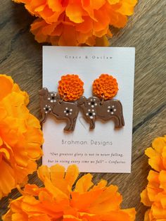 Polymer clay Brahman cow marigold earrings Marigold Earrings, Brahman Cow, Halloween Shopping, Jewelry Earrings Dangle, Etsy Earrings, Dangle Drop Earrings, Polymer Clay, Cow, Dangle Earrings