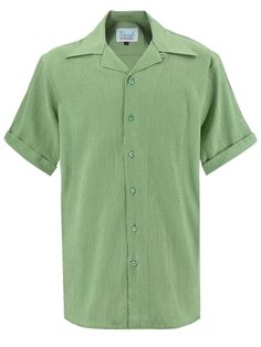 This men's seersucker leisure shirt is a mild green shade, and takes design cues from 1940s and 50s pieces. The easy-care textured cotton blend fabric makes it both a stylish and practical option for warm temperatures, whether on a trip to the beach, a festival, or a jaunt abroad. - Breathable, textured cotton blend fabric - Open-neck collar with loop and button decor - Yoke stitched across the back shoulders - Short sleeves, approx. 10" long, with a stitched cuff and a central notch detail - Sm Classic Green Collared Short Sleeve Shirt, Classic Green Short Sleeve Shirt, Green Classic Short Sleeve Shirt With Camp Collar, Classic Green Short Sleeve Shirt With Camp Collar, Solid Vintage Summer Shirt, Vintage Green Shirt For Summer, Vintage Green Summer Shirt, Vintage Summer Shirt, Palm Green