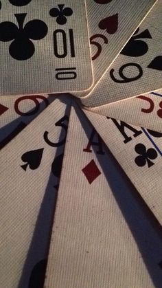 playing cards are arranged in the shape of spades