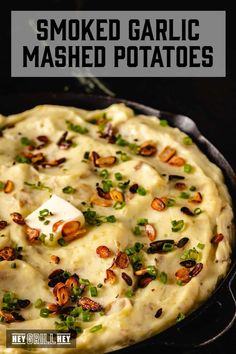 a baked mashed potato dish in a cast iron skillet with text overlay that reads, smoked garlic mashed potatoes