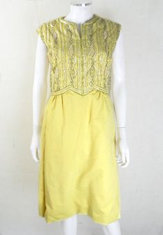 "Amazing Original 1950s Vintage Yellow Beaded Cocktail Dress UK Size 12 Wow! We adore this glorious 50s cocktail dress in all it's yellow glory! Fitted bodice encrusted with stunning silver beads, pearls and iridescent sequins for the ultimate in vintage glamour. This mid-toned yellow looks great on most skin tones and the fit and flare style is super flattering! Made by the Miss Smart label from a lovely heavyweight cotton, this is perfect for special occasions, black tie events and more! Non s Yellow 1950s Style Dress For Vintage Fashion, 1950s Style Yellow Dress For Vintage Fashion, Retro Yellow Party Dress, Retro Yellow Wedding Dress, 1950s Style Yellow Party Dress, Yellow Vintage Dress For Vintage Events, Fitted Yellow Vintage Dress For Party, Yellow Fitted Vintage Dress For Parties, Fitted Yellow 1950s Dresses