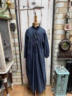 Antique French dark inky blue cotton dress nightdress with lace neck size S/M. 100% Cotton. Dyed a dark inky blue. High neck with lace trim, button tab and lace trim, long sleeves. Size:  Chest: 44 inches; Shoulder to shoulder: 20 inches; Sleeve length: 18 inches; armhole width: 8.5 inches; cuff width: 4 inches; Length: 52 inches. Weight: allow up to 1 kg once packed. Condition commensurate with age and use - some white marks on front but otherwise ok and all part of its charm and character. Pri Black Cotton Sleep Dress, Black Cotton Dress, Blue Cotton Dress, Black Cotton Dresses, Lace Neck, White Mark, Dress Clothes For Women, Cotton Dress, Night Dress