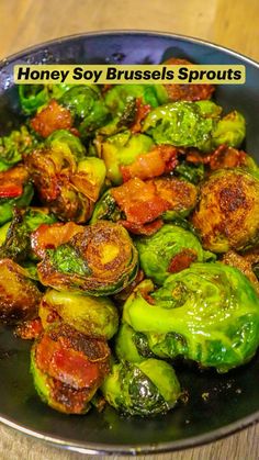 a pan filled with cooked brussel sprouts on top of a wooden table