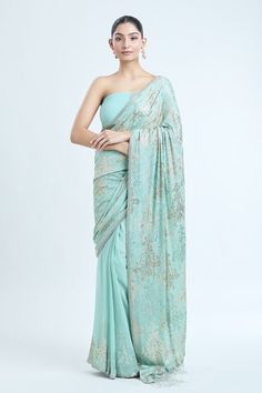 Porcelain blue saree with abstract pattern sequin embellishments. Comes with matching sequin embellished blouse. - Aza Fashions Transitional Blue Georgette Blouse Piece, Blue Fitted Pre-draped Saree For Transitional Season, Blue Sequined Pre-draped Saree, Blue Sequined Saree Traditional Wear, Blue Sequined Traditional Wear With Drape, Blue Traditional Wear With Sequins, Formal Silk Pre-draped Saree With Sequins, Festive Blue Pre-draped Saree With Sequins, Blue Georgette Pre-draped Saree For Formal Occasions