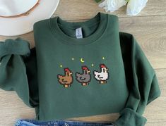 EMBROIDERED Stardew Valley Chicken Sweatshirt, Perfect Gift for Gamers, Stand Out With Gaming-inspired Fashion, Handcrafted Gaming Apparel - Etsy Stardew Valley Chicken, Pumpkin Shirt, Stardew Valley, Halloween Tees, Gaming Clothes, Gamer Gifts, Cozy Sweatshirts, Embroidered Sweatshirts, Look Plus