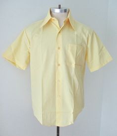 Fantastic find... unworn vintage 1960's light butter yellow short sleeve dress shirt from Macrae Prest. Lightweight, smooth and nicely soft, 65% polyester, 35% cotton, 'Never Needs Pressing'. Features - big dagger point collar - left chest pocket - U-hem APPROXIMATE MEASUREMENTS in inches - lying flat Size:  15-1/2 or Medium Shoulder to shoulder:  19 Chest, armpit to armpit:  23 Waist:  22 Length, center back:  33 CONDITION Excellent, unworn, vintage condition with no wear.  Looks like it was ju Yellow Fashion Men, Creepy Wedding, Business Shirts Men, Yellow Dress Shirt, Yellow Shirt Outfit, Light Yellow Dresses, Yellow Shirt Dress, Rat Pack, Pack Light