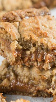 two cookies stacked on top of each other with caramel toppings in the middle