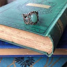 Victorian style filigree ring measuring 18mm wide at the widest point and fully adjustable. Choose antiqued silver or antiqued brass. In the center is a 10x8mm oval aventurine cabochon. Aventurine is medium green with a metallic iridescence caused by fuchsite (green mica) inclusions. The look of the stone you receive may vary slightly from the one pictured. I do not recommend wearing this jewelry while bathing or swimming although simple hand washing is fine. Be sure to search my shop for other Irish Jewelry Rings, Aventurine Ring, Green Aventurine Stone, Fan Jewelry, Aventurine Stone, Accesories Jewelry, Irish Jewelry, Filigree Ring, Victorian Jewelry