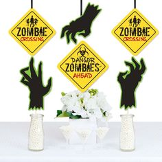 halloween decorations with zombie crossing signs and flowers