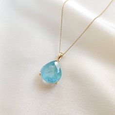 This stunning pendant is set in 14K Solid Yellow Gold with Natural Aquamarine with utmost precision. It is an unique gemstone pendant for nearly every occasion and is completely hassle-free jewelry. ITEM DETAILS * Gem: Aquamarine * Gem Size: 14X15mm * Gem Shape: Pear * Gem Weight: 10.87 carats * Gold Purity: 14KT  * Gold Weight: 1.16 gram * Total Weight of the Pendant: 3.33 gram The Gold purity is guaranteed and it comes with authentic 14KT gold hallmark. Since my items are handmade, they are absolutely nickel and lead free. CUSTOMIZATION * Gemstone customization is available and it can be substituted with a gem of your choice. Kindly message me for the same. PACKAGING * The Pendant comes with layers of safe and secure wrapping along with Free handmade jewelry box with every purchase. ➡️He Pisces And Aquarius, Aquamarine Gem, Handmade Jewelry Box, Aquamarine Pendant, Aquamarine Jewelry, March Birthstone, Bezel Pendant, Jewelry Christmas, Birthstone Pendant