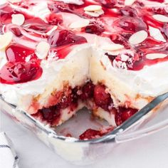 a cake with cherries and almonds on top in a pan, ready to be eaten