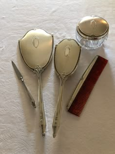 Beautiful Vintage 5 piece Sterling Silver Vanity Set with Comb, Brush, Hand Mirror, Nail File and Crystal Powder Jar that will elegantly grace any vanity. Add a touch of instant glamour with beautiful workmanship. A set for the discriminating buyer who appreciates the finer things of the days gone by. Vintage Hair Brush Aesthetic, Coquette Hairbrush, Vintage Brush Set, Forest Makeup, Silver Vanity Set, Antique Vanity Set, Silver Vanity, Vintage Comb, Pocket Comb