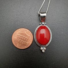 "Visit our on-line shop at: Etsy.com/shop/AlbuquerqueDesigns *sterling silver necklace pendant *pendant with silver box chain necklace 18\" *southwestern jewelry *big bamboo red coral *calibrated pre-cut stones: 18x13mm oval shape *all jewelry items are made to ship, slight variations in stones will occur comparing to pictures *size of a penny is 19mm or a dime is 18mm in diameter for comparing size with jewelry items *handcrafted in USA *free convenient gift box *free shipping in US, ship from Red Jewelry With Large Oval Pendant, Southwestern Red Round Jewelry, Southwestern Style Round Pendant Necklace, Southwestern Style Round Red Jewelry, Red Sterling Silver Necklace With Round Pendant, Red Sterling Silver Jewelry With Polished Finish, Red Cabochon Round Pendant Jewelry, Red Sterling Silver Necklace Stamped 925, Red Oval Sterling Silver Necklace