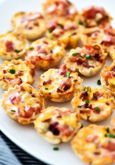 small appetizers are arranged on a white plate