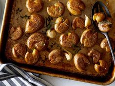 a baking pan filled with potatoes and onions