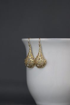 "Bold and detailed matte gold vermeil filigree charms simply dangle from gold vermeil balled earwires. These dramatic cut out charm earrings complete any outfit for daytime or evening. Gold charms: 19x32mm Total length of earrings: 1 3/4\" All gold is 18k gold vermeil. As the owner, maker, designer, and curator of this shop, I take great pride in providing you with jewelry that you will love to wear everyday, for special occasions, and for many years to come. Please read my Shop Policies which c Elegant 14k Gold Chandelier Earrings, Formal Yellow Gold Chandelier Earrings With Intricate Design, 14k Yellow Gold Earrings With Intricate Design, Exquisite Filigree Earrings For Formal Occasions, 14k Gold Filigree Dangle Jewelry, 14k Gold Filigree Earrings, Classic 14k Gold Filigree Earrings, Elegant 14k Yellow Gold Chandelier Earrings, Gold 14k Elegant Earrings