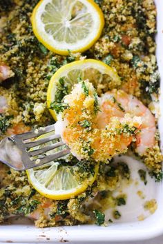 a close up of a fork in a casserole with shrimp and broccoli