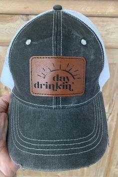 Distressed Trucker Hat with a front leather patch. Available in red, green or black. Images available Day Drinker, Beach Babe or Summer Vibes. Distressed Casual Trucker Hat For Outdoor, Casual Distressed Trucker Hat For Outdoor, Casual Trucker Hat With Leather Patch, Casual Hats With Leather Patch - One Size, Casual Hats With Leather Patch, Casual Black Trucker Hat With Leather Patch, Casual Distressed Brown Hat For Outdoor, Camping Hats, Hot Cocoa Party