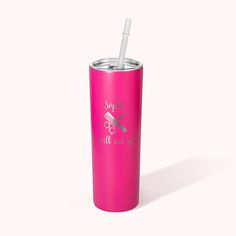 a pink tumbler cup with a straw in it and some writing on the side