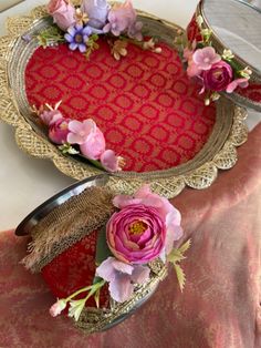 two decorative trays with flowers on them