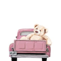 a teddy bear sitting in the back of a pink truck