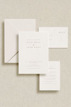 the wedding stationery is laid out on top of each other, with two envelopes