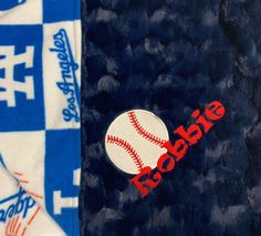 a close up of a towel with a baseball on it