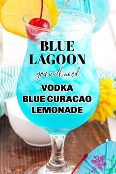 the blue lagoon cocktail is garnished with orange slices and cherries