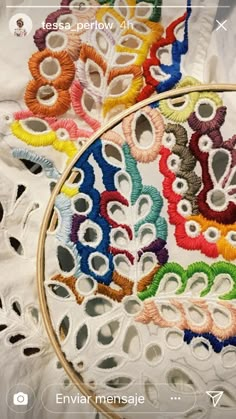 a close up of a embroidery project on a cell phone