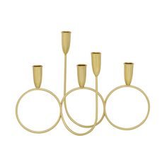 four gold candlesticks are arranged in the shape of three circles with one candle on each side