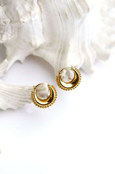 Introducing the rekha, a statement hoop earring that is a blend of western flair and south asian tradition. Drawing inspiration from the golden era of bollywood in the 70s, the rekha brings a touch of desi charm to a classic western earring silhouette. Made for everyday wear. Designed and crafted with intention, made ethically in india with recycled materials. Festive Brass Hoop Earrings With Latkans, Bohemian Round Chandbalis For Pierced Ears, Handmade Chandbalis For Festival, Round Chandbalis For Festival, Brass Chandbali Hoop Earrings With Latkans, Chandbali Hoop Earrings With Latkans, Gold Bollywood Festival Earrings, Gold Bollywood Earrings For Festival, Bollywood Style Gold Earrings For Festival