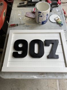 there is a sign that says'907'on it and paint next to it