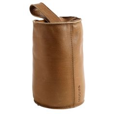 a brown leather canister with the lid open