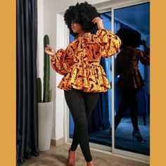 Maeotti Figure-Flattering African Ankara Print Bibi Blouse Featuring A Bright, Honey Yellow Cotton Fabric With A Black, Red, And Gray Print. This Blouse Was Designed For A Naturally Curvaceous Physique With A Peplum Waist, Exposed Matching Full Zipper Back With Decorative Zipper Pull, Clear Button Back Neck Closure, Mock Turtleneck With Extra Long Ribbon Tie, And Extra Long Bishop Sleeves. * Top Is Unlined * Has A Long Back Zipper * Puff Sleeve With Elastic Band * Has A Fancy Bow At The Neck * C Yellow Cotton Fabric, Pink Maternity Dress, Kente Dress, Pixie Dress, Fancy Bows, 1920s Flapper Dress, Free Fabric Swatches, African Print Fashion, Plus Size Maxi Dresses