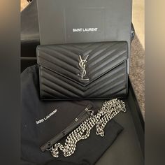 A Gorgeous Like New Pred Ysl Woc Crossbody With Shw. Condition Shown Via Pictures And Listed Via This Description. (Please Closely Review). Preloved Condition/Grade: A+/A (Like New) Call Outs: * Minor Hairline Scratches To Hardware Inclusions: Giftable Condition Ysl Dust Bag And Box Authenticated By Real Authentication Additional Authentication By Poshmark Reseller Comps: $1000-$1600 (Without Taxes) Pricing Depends On Condition/Wear Of Luxury Item Retail: $1690 (Without Taxes) Thank You For Your Ysl Envelope Bag Black, Ysl Woc, Yves Saint Laurent Bags, Chain Wallet, Wallet Chain, Luxury Items, A A, Yves Saint Laurent, Saint Laurent